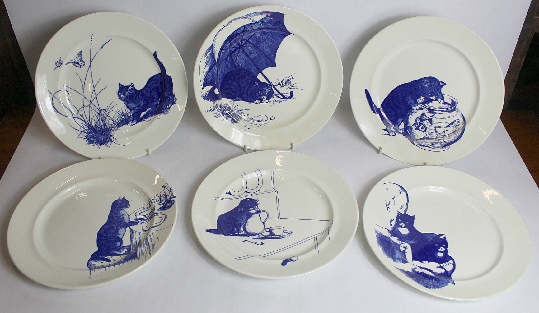 Six National Trust Poole Pottery blue and white plates, replicas of the Cat Plates in the servants