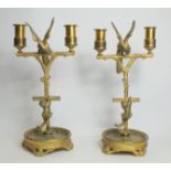 Pair of 19th century ormolu twin sconce candelabra, the naturalistic columns of perch form,