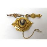 Victorian gold brooch with pearl set garnet and two others '15'. (3).