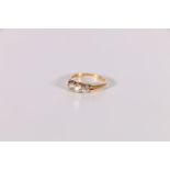 Early 20th century diamond three stone ring with brilliants approx. .20 and .4 ct in gold with