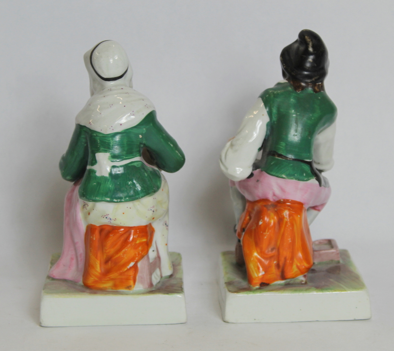 Pair of 19th century porcelain figures of a cobbler and his wife seated on a square plinth base - Image 2 of 3