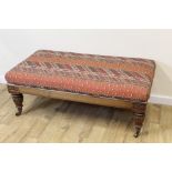 Victorian style upholstered stool of large size on baluster supports. 65cm x 130cm (reconstructed).