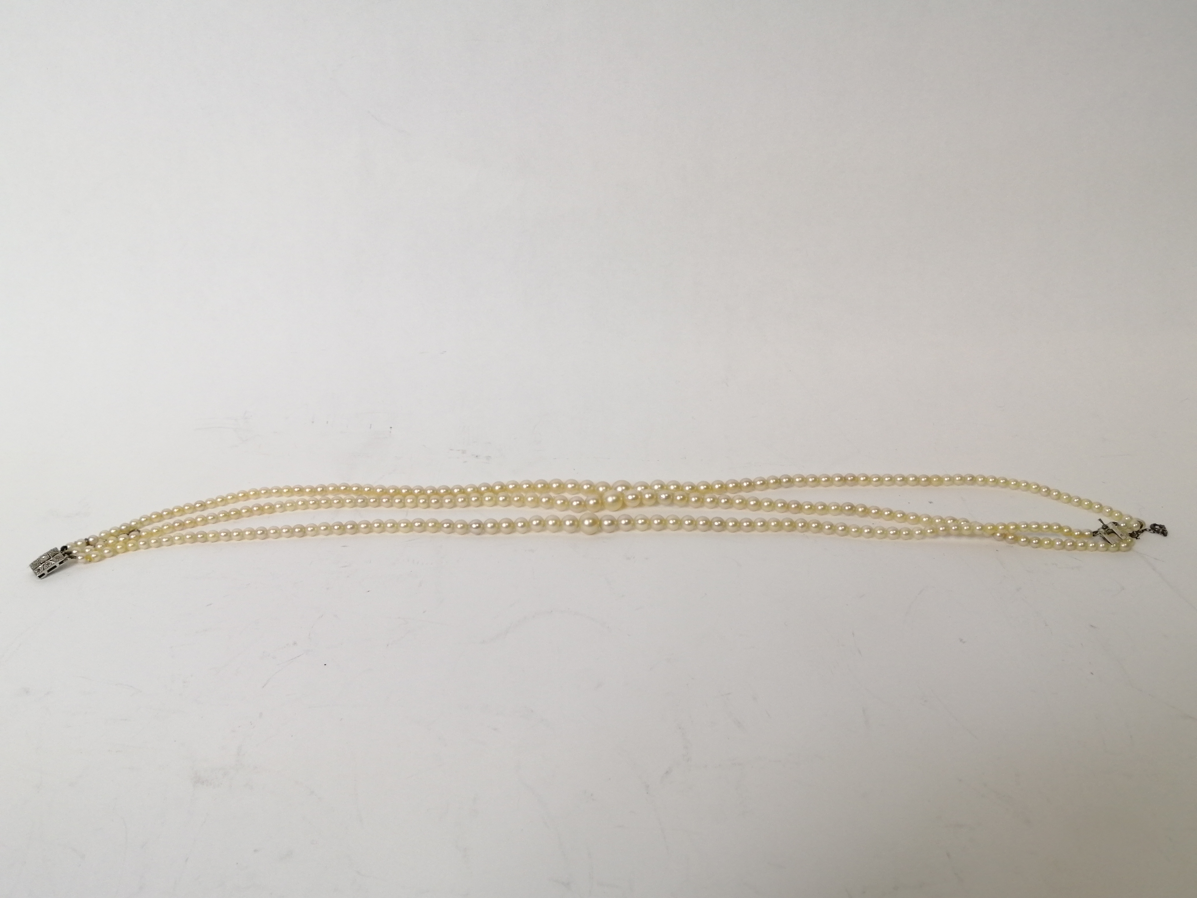 Three strand cultured pearl necklace, on French white gold snap with diamonds. - Image 4 of 5