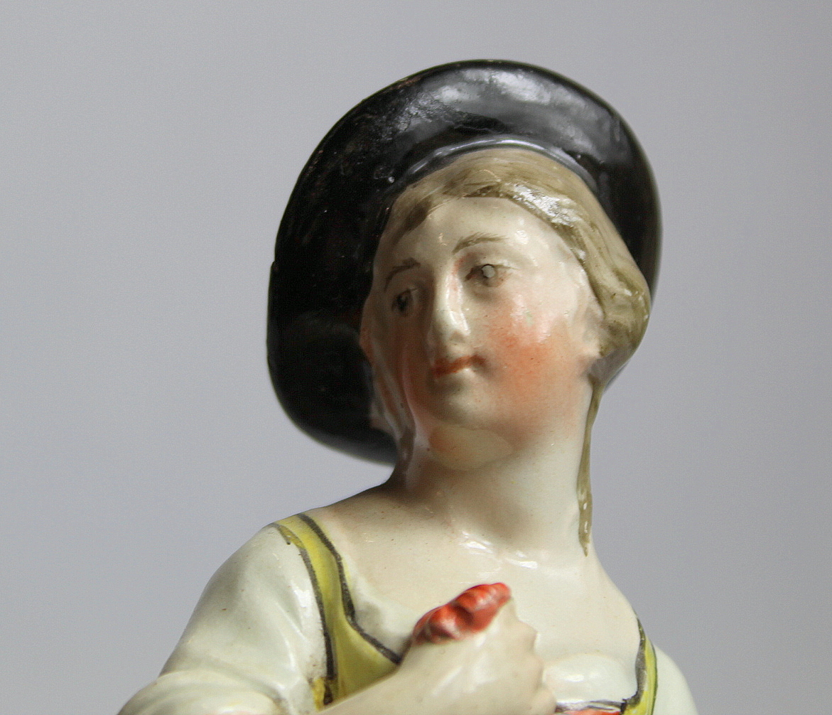 19th century pearlware figure of a farm girl carrying a basket of flowers, on square plinth base - Image 7 of 8