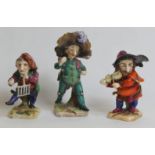 Set of three Derby style porcelain figures of grotesque punches or dwarfs, the largest 11cm high,