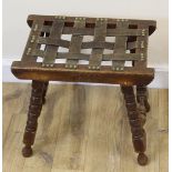 Oak leather topped woven stool on turned supports.