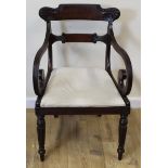 Regency mahogany carver chair with outswept scroll arms and slip in seat on turned reeded supports.