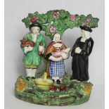 Late 19th/Early 20th century Staffordshire pottery Tythe Pig group, the farmer, his wife and parson