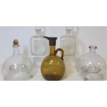 Two antique blown clear glass wasp traps; a pair of small square blown glass decanters, each 17cm