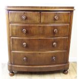 Victorian mahogany bowfront chest of two short and three long drawers raised on bun feet. Label