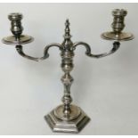 Silver candelabrum of George 1st style with scrolling arms and hexagonal knopped stem and base,