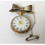 Swiss enamelled gold lever watch, keyless, with coloured gold wreath and pearl bezel, '14k',