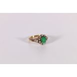 Diamond and emerald ring, oval with ten collet set eight cut brilliants and two others in the