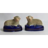 Pair of 19th century Staffordshire pottery inkwells in the form of recumbent sheep with textured
