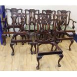 Set of eight Chippendale style dining chairs, pierced spalts, slip in seats raised on ball and