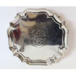 Silver square waiter with shaped corners and moulded edge, initialled, on scroll feet by Louis