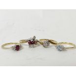 Two ruby and diamond rings, a diamond cluster ring and an aquamarine and diamond ring, all 9ct gold.