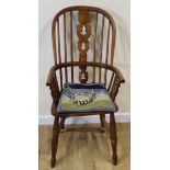 Windsor chair with pierced splat and shaped seat on turned supports with stretcher.