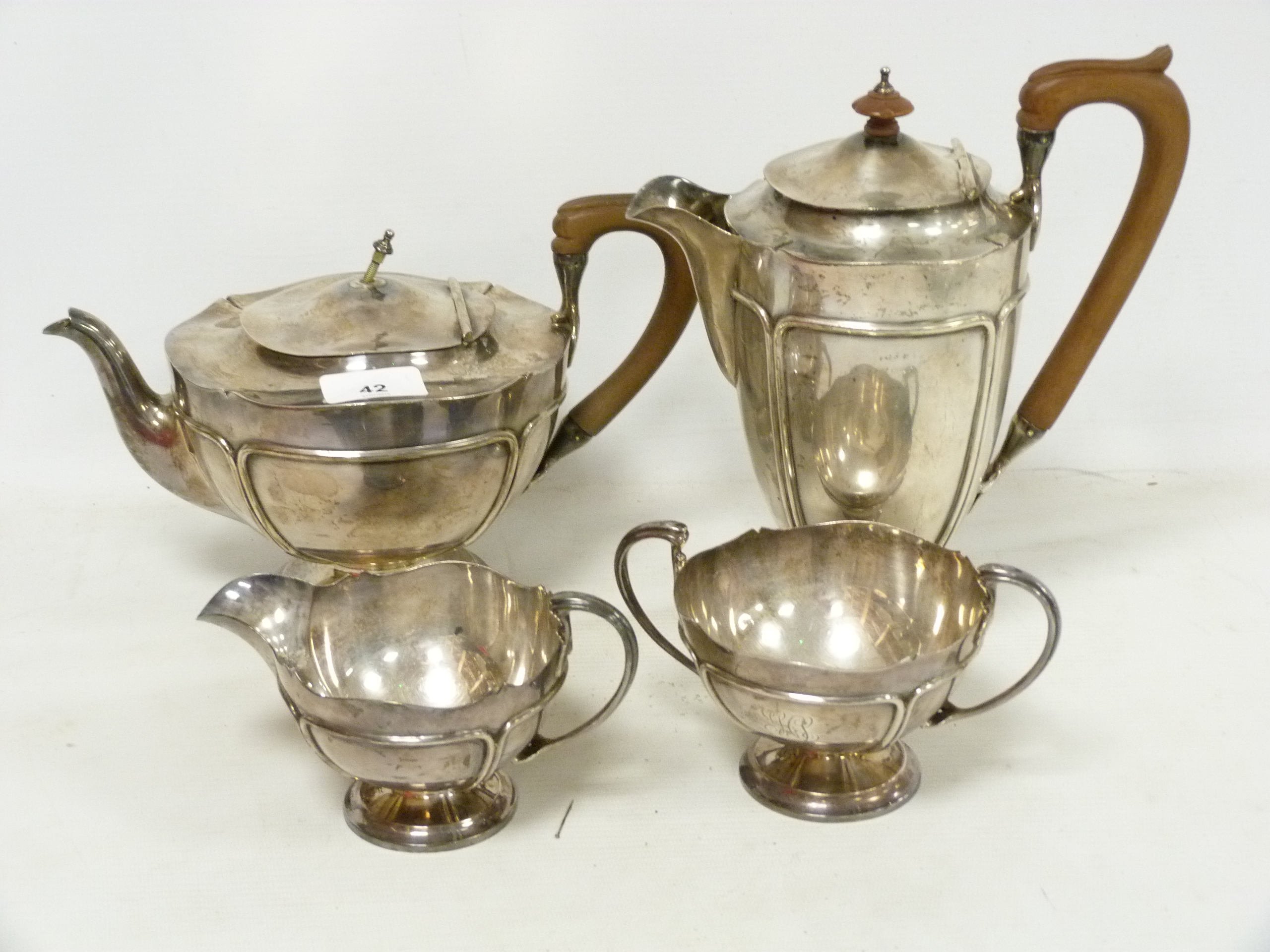 Silver four piece tea set of Art Nouveau style, hemispherical with moulded panels, by Brook &