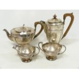 Silver four piece tea set of Art Nouveau style, hemispherical with moulded panels, by Brook &