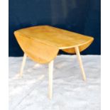 Ercol drop-flap table with oval top, raised on splayed tapering square legs, 113cm wide, 71cm high