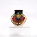 Moorcroft 'Anna Lily' squat baluster vase with black and cream ground, marks to the base, 8.5cm