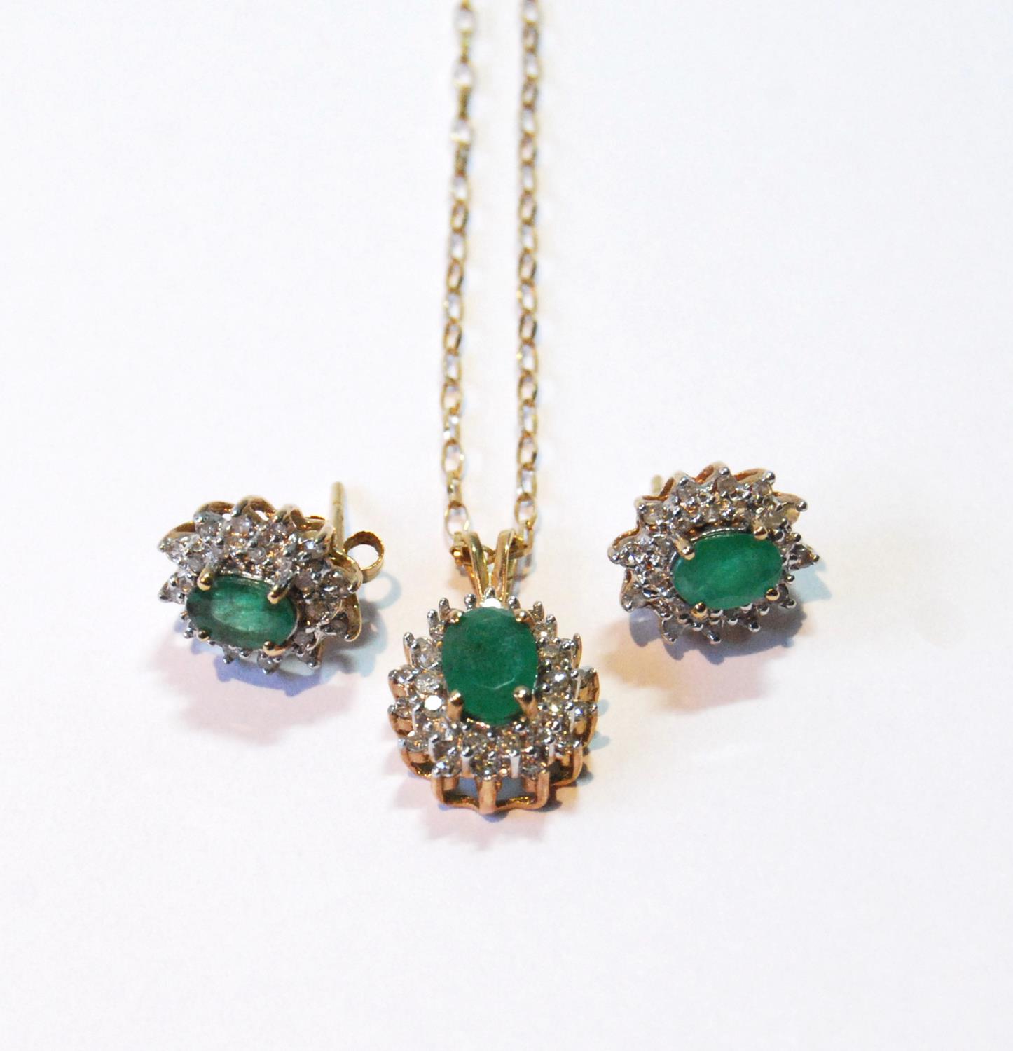 Emerald and diamond cluster pendant and a pair of matching earrings, 9ct gold.   (3)