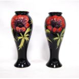Pair of Moorcroft 'Anemone' baluster vases, each with blue ground and marks to the base, 28cm high.