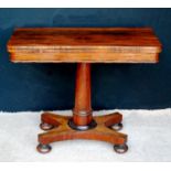 William IV rosewood card table, the rounded rectangular top with baize lining, raised on tapering