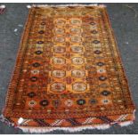 Tekke rug with two rows of seven guls over orange ground, multiple borders, 106cm x 85cm.