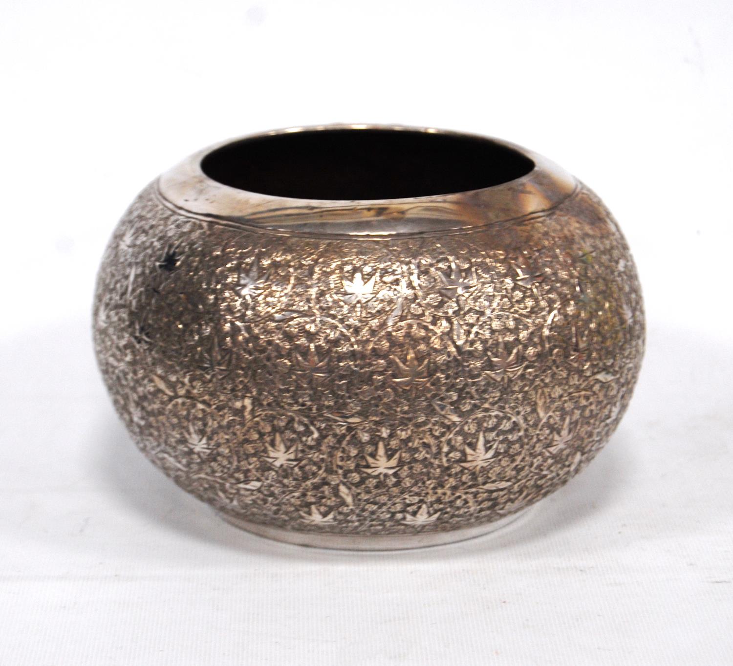 Indian silver embossed bowl of almost globular shape.
