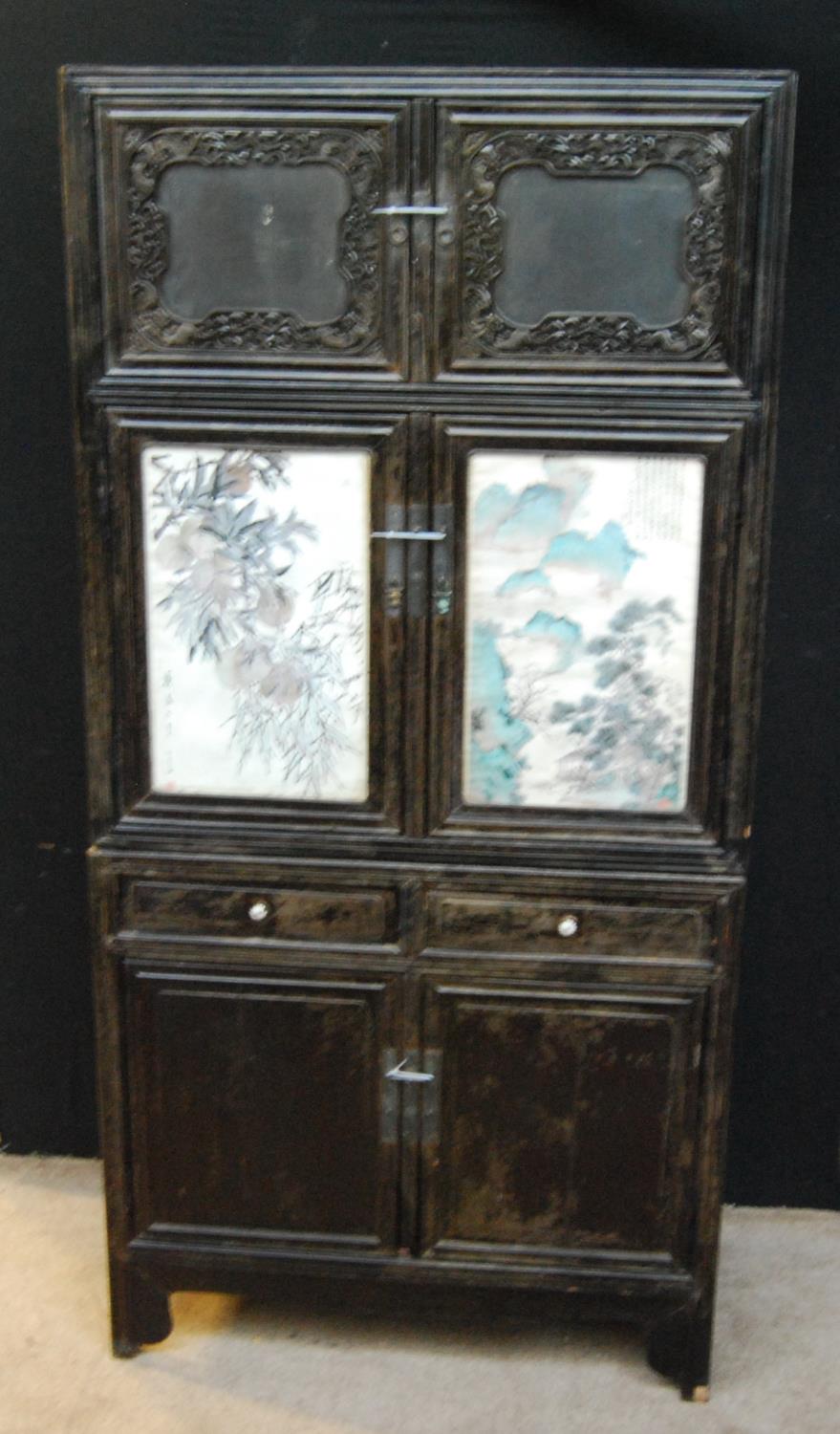 Chinese cabinet of rectangular form with pierced fretwork, mirrored doors, panelled doors and