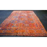 Turkoman carpet with three rows of four medallions over blue ground, two rows of seven cruciforms,