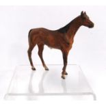Cold painted bronze model of a horse, unsigned, 8.5cm high.