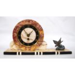 Art Deco alabaster mantel clock with circular face, Roman numerals and cast bird, on plinth base,