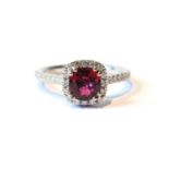 Ruby and diamond cluster ring of cushion shape with diamond brilliants and similarly-set