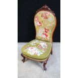 Victorian lady's chair, the pierced finial over floral needlepoint back and seat, raised on cabriole
