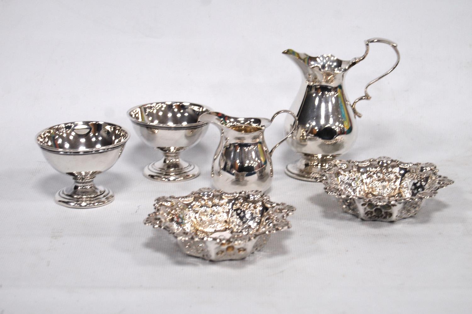 Silver cream jug, c. 1890, another, smaller, Birmingham 1910, a pair of sweetmeat dishes, 1900,