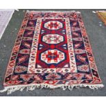 Turkish rug with three cruciform octagonal panels, star and floral triple border, 120cm x 93cm.