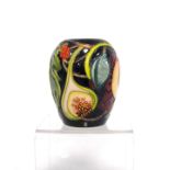 Moorcroft 'Queen's Choice' squat vase decorated with figs, grapes and peaches over blue ground,