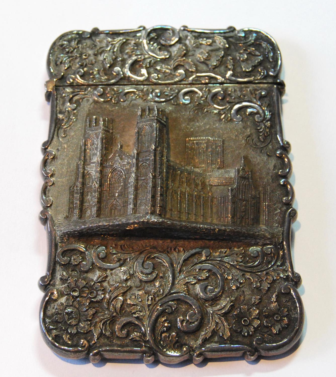 Silver 'castle top' card case with a view of York Minster in high relief amongst scrolls by