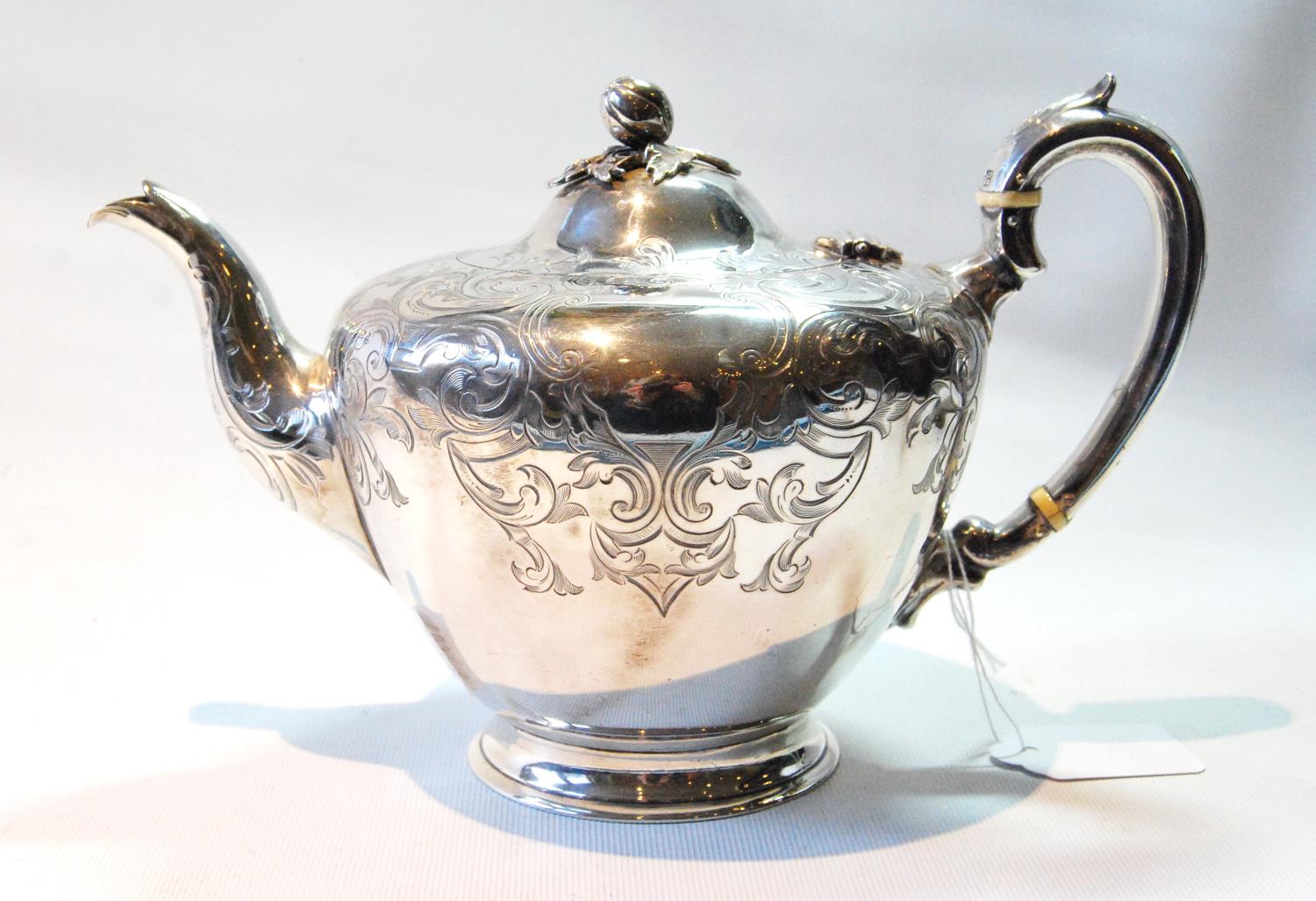 Victorian silver teapot of half ovoid shape with engraved scrolls by Pearce & Burrows, 1850, 20oz.