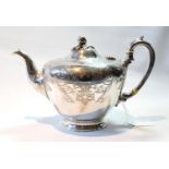 Victorian silver teapot of half ovoid shape with engraved scrolls by Pearce & Burrows, 1850, 20oz.