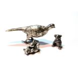 Silver model of a pheasant, Import Marks, George Stocker, 1930, and two cast models of bears, 3oz.