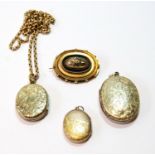 Victorian gold oval boss brooch and three lockets, one with necklet, some part gold.