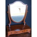 Mahogany serpentine dressing glass, the boxwood strung shield shaped swing mirror on serpentine