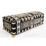 Early 20th century Indian casket with all over pierced ivory fretwork panels and strapping depicting