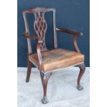 Early 20th century Chippendale style open armchair with floral carved arched top rail over pierced