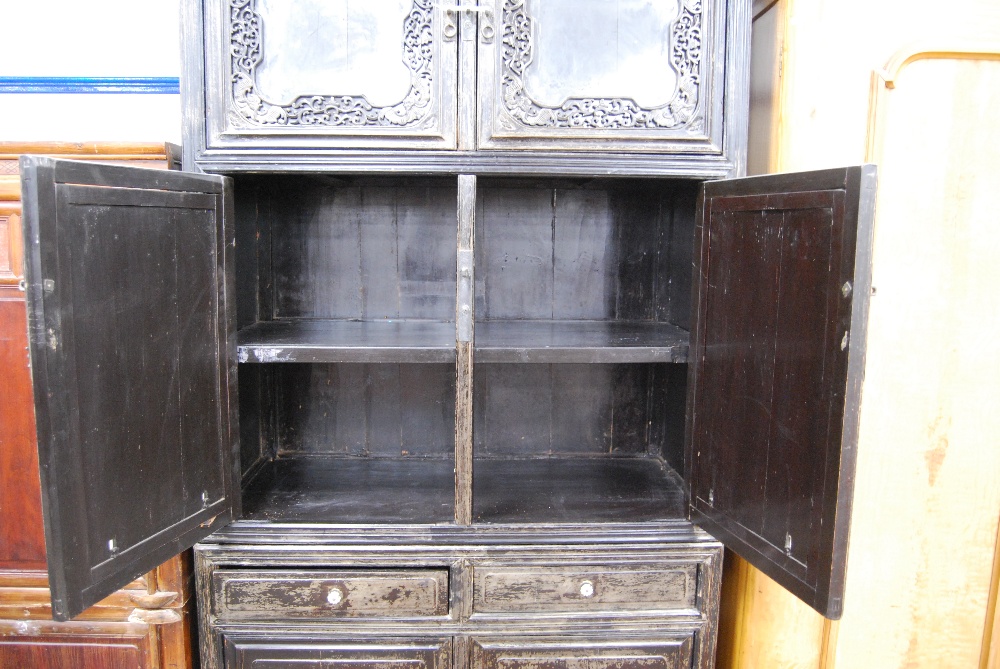 Chinese cabinet of rectangular form with pierced fretwork, mirrored doors, panelled doors and - Image 10 of 11