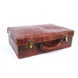 Vintage crocodile skin case with brass locks, monogrammed 'M.B.', 38cm wide, 12cm high and 25cm